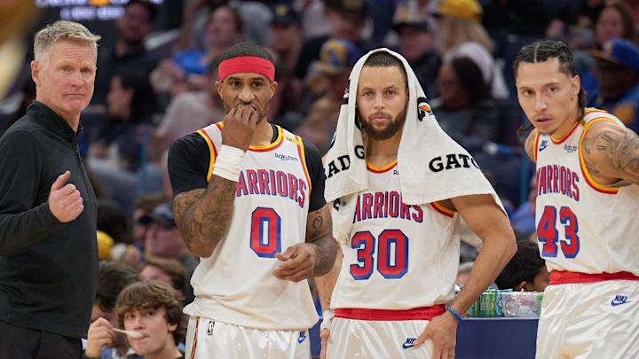 Jan 18, 2025; San Francisco, California, USA; Golden State Warriors head coach Steve Kerr, guard Gary Payton II (0), guard Stephen Curry (30) and forward Lindy Waters III (43) during a timeout against the Washington Wizards during the third quarter at Chase Center. Mandatory Credit: Robert Edwards-Imagn Images Jan 18, 2025; San Francisco, California, USA; Golden State Warriors head coach Steve Kerr, guard Gary Payton II (0), guard Stephen Curry (30) and forward Lindy Waters III (43) during a timeout against the Washington Wizards during the third quarter at Chase Center. Mandatory Credit: Robert Edwards-Imagn Images