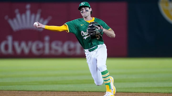 Sep 21, 2024; Oakland, California, USA; Oakland Athletics shortstop Jacob Wilson (5) throws the ball to first to record an out against the New York Yankees in the ninth inning at the Oakland-Alameda County Coliseum. Mandatory Credit: Cary Edmondson-Imagn Images