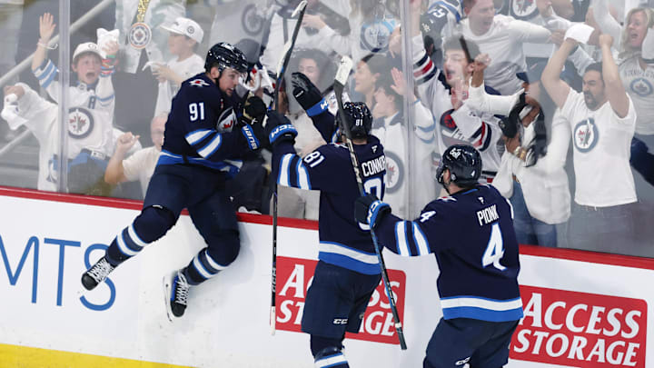 Jets center Cole Perfetti (91) celebrates his tying goal with 1.6 seconds left to force an improbable overtime in Game 7 against the  Blues.