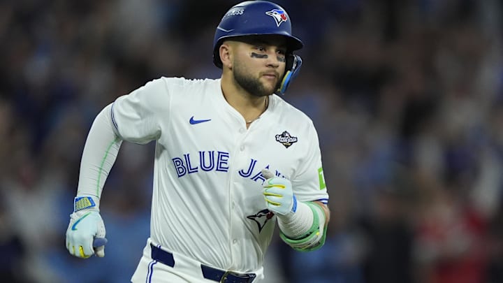 Nov 1, 2025; Toronto, Ontario, CAN; Toronto Blue Jays designated hitter Bo Bichette (11) runs after hitting a three run home run against the Los Angeles Dodgers in the third inning during game seven of the 2025 MLB World Series at Rogers Centre. 