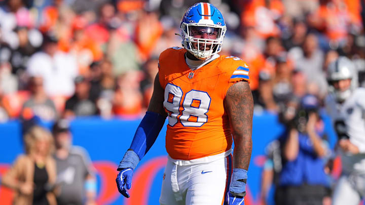 Oct 6, 2024; Denver, Colorado, USA; Denver Broncos defensive end John Franklin-Myers (98) reacts to a defensive stop in the second half against the Las Vegas Raiders at Empower Field at Mile High. 