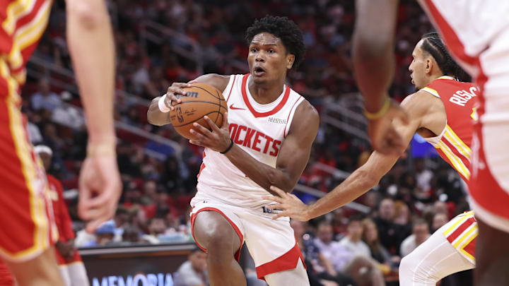Oct 6, 2025; Houston, Texas, USA; Houston Rockets guard Amen Thompson (1) drives with the ball during the second quarter against the Atlanta Hawks at Toyota Center. Mandatory Credit: Troy Taormina-Imagn Images