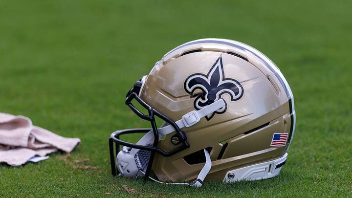 Aug 08, 2026; Metairie, LA, USA; Detailed view of the Saints NFL helmet during training camp at Ochsner Sports Performance Center. Mandatory Credit: Stephen Lew-Imagn Images Aug 08, 2026; Metairie, LA, USA; Detailed view of the Saints NFL helmet during training camp at Ochsner Sports Performance Center. Mandatory Credit: Stephen Lew-Imagn Images