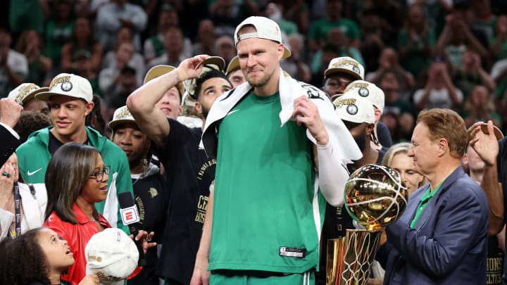 Jun 17, 2024; Boston, Massachusetts, USA; Boston Celtics center Kristaps Porzingis (8) celebrates after winning the 2024 NBA Finals against the Dallas Mavericks at TD Garden. Mandatory Credit: Peter Casey-USA TODAY Sports