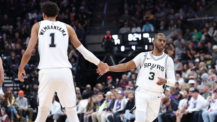 Oct 31, 2024; Salt Lake City, Utah, USA; San Antonio Spurs center Victor Wembanyama (1) and guard Chris Paul (3) react after a play against the Utah Jazz during the fourth quarter at Delta Center. Mandatory Credit: Rob Gray-Imagn Images