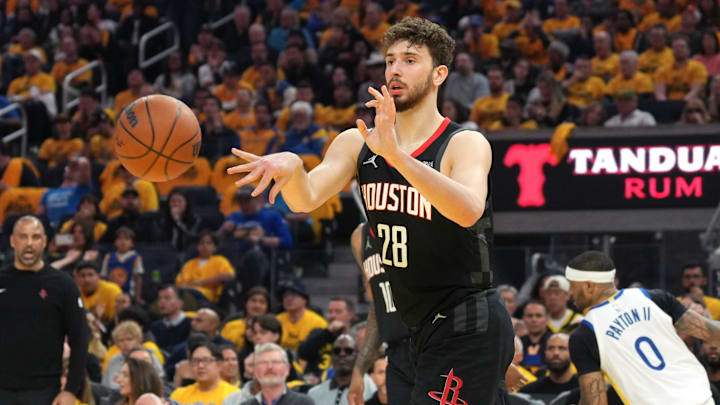 Apr 26, 2025; San Francisco, California, USA; Houston Rockets center Alperen Sengun (28) passes against the Golden State Warriors during the second quarter of game three of first round for the 2024 NBA Playoffs at Chase Center. Mandatory Credit: Darren Yamashita-Imagn Images