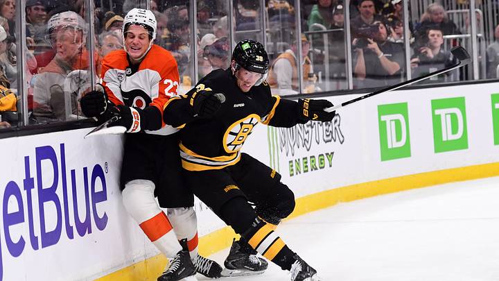 Sep 22, 2026; Boston, Massachusetts, USA;  Boston Bruins center Morgan Geekie (39) checks Philadelphia Flyers forward Jack Studnicka (23) during the second period at TD Garden. Mandatory Credit: Bob DeChiara-Imagn Images