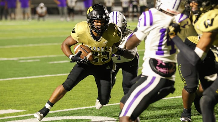 Warren Central Kendall Garnett breaks free for the goal line and the winning 6 points in overtime vs. Ben Davis. Warren Central Kendall Garnett breaks free for the goal line and the winning 6 points in overtime vs. Ben Davis.