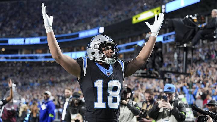 Jan 10, 2026; Charlotte, NC, USA; Carolina Panthers wide receiver Jalen Coker (18) celebrates his score with fans during the second half of the NFC Wild Card Round game between the Carolina Panthers and the Los Angeles Rams at Bank of America Stadium. Mandatory Credit: Jim Dedmon-Imagn Images Jan 10, 2026; Charlotte, NC, USA; Carolina Panthers wide receiver Jalen Coker (18) celebrates his score with fans during the second half of the NFC Wild Card Round game between the Carolina Panthers and the Los Angeles Rams at Bank of America Stadium. Mandatory Credit: Jim Dedmon-Imagn Images