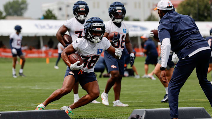 Jul 26, 2024; Englewood, CO, USA; Denver Broncos running back Jaleel McLaughlin (38) during training camp at Broncos Park Powered by CommonSpirit. 
