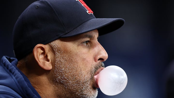 Sep 19, 2024; St. Petersburg, Florida, USA; Boston Red Sox manager Alex Cora (13) looks on from the dugout against the Tampa Bay Rays in the fourth inning at Tropicana Field. Mandatory Credit: Nathan Ray Seebeck-Imagn Images