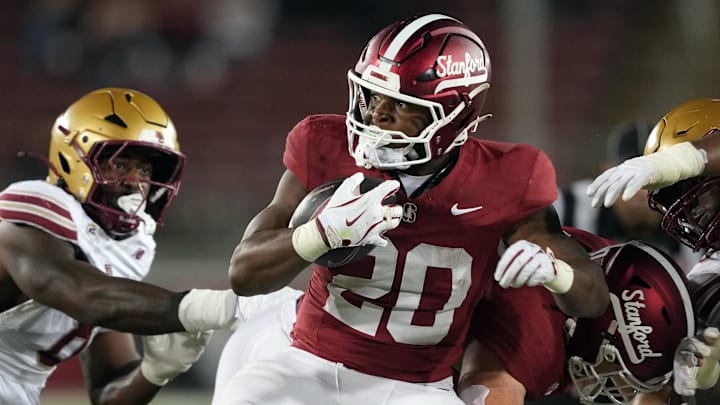 Sep 13, 2025; Stanford, California, USA; Stanford Cardinal running back Micah Ford (20) carries the ball against the Boston College Eagles during the fourth quarter at Stanford Stadium. Mandatory Credit: Darren Yamashita-Imagn Images