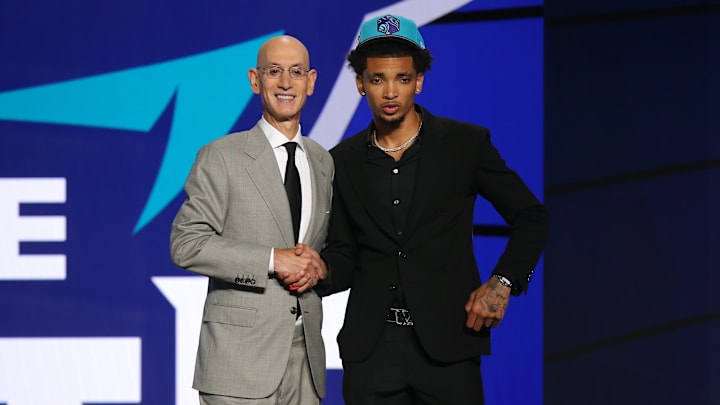 Jul 29, 2021; Brooklyn, New York, USA; James Bouknight (Connecticut) poses with NBA commissioner Adam Silver after being selected as the number eleven overall pick by the Charlotte Hornets in the first round of the 2021 NBA Draft at Barclays Center. Mandatory Credit: Brad Penner-Imagn Images