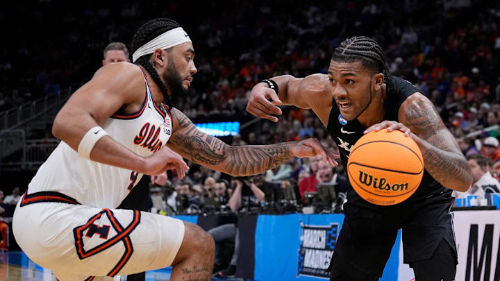 Xavier guard Dayvion McKnight (20) drives up the court as he is guarded by Illinois guard Kylan Boswell (4) during the second half of their first round NCAA men’ s basketball tournament game on Friday March 21, 2025 at Fiserv Forum in Milwaukee, Wis.