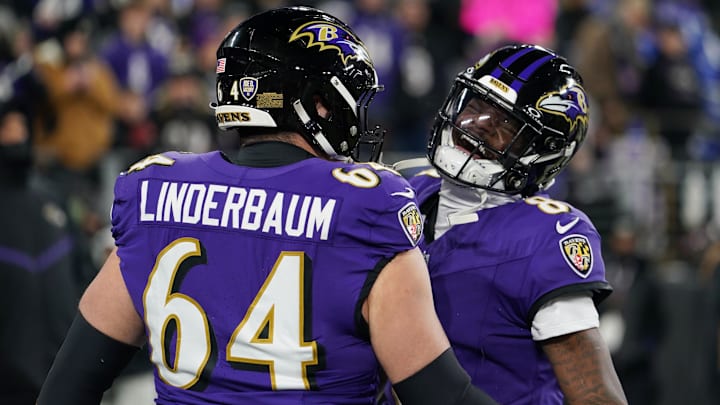 Baltimore Ravens quarterback Lamar Jackson (8) and center Tyler Linderbaum (64) warm up before an AFC Wild Card game against the Pittsburgh Steelers at M&T Bank Stadium. 