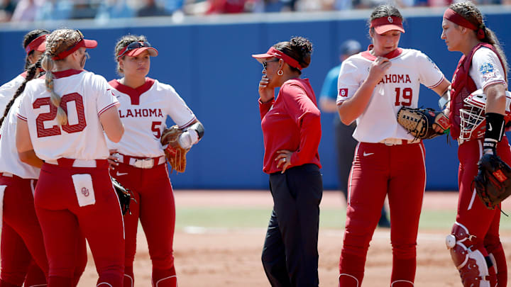 Oklahoma Associate Head Coach Jennifer Rocha talks the team in the Women's College World Series softball game between the Oklahoma Sooners and the UCLA Bruins at USA Softball Hall of Fame Stadium in Oklahoma City, Monday, June 6, 2022. 