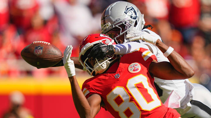 Oct 19, 2025; Kansas City, Missouri, USA; Las Vegas Raiders cornerback Darnay Holmes (30) breaks up a pass intended for Kansas City Chiefs wide receiver Tyquan Thornton (80) during the second quarter of the game at GEHA Field at Arrowhead Stadium.