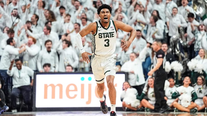 Michigan State guard Jaden Akins celebrates a 3-point basket against Michigan during the first half at Breslin Center in East Lansing on Sunday, March 9, 2025.