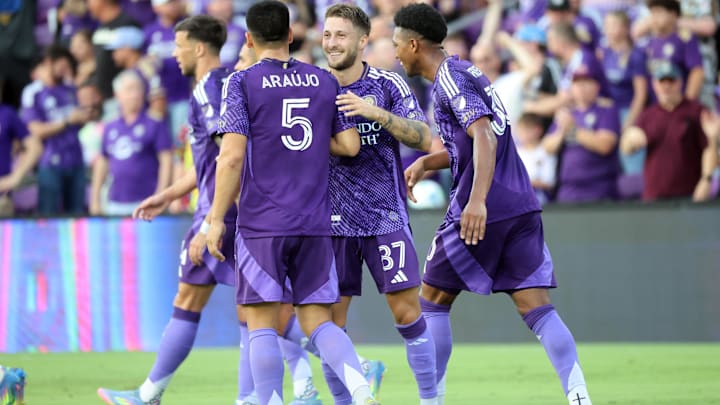 May 21, 2025; Orlando, Florida, USA; Orlando City forward Marco Pasalic (87) is congratulated by midfielder Cesar Araujo (5) after scoring a goal against the Nashville SC  during the first half at Inter&Co Stadium. Mandatory Credit: Kim Klement Neitzel-Imagn Images