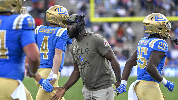 Nov 30, 2024; Pasadena, California, USA; UCLA Bruins head coach DeShaun Foster greets his players after a Bruins touchdown against the Fresno State Bulldogs in the third quarter at Rose Bowl. Mandatory Credit: Robert Hanashiro-Imagn Images
