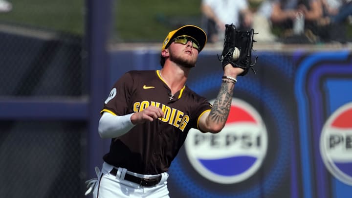 Feb 24, 2024; Peoria, Arizona, USA; San Diego Padres left fielder Jackson Merrill catches a fly ball