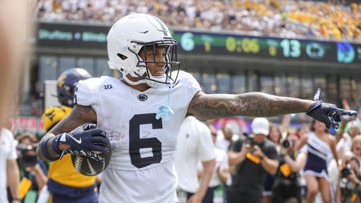 Aug 31, 2024; Morgantown, West Virginia, USA; Penn State Nittany Lions wide receiver Harrison Wallace III (6) celebrates after catching a pass for a touchdown during the second quarter against the West Virginia Mountaineers at Mountaineer Field at Milan Puskar Stadium. Mandatory Credit: Ben Queen-Imagn Images