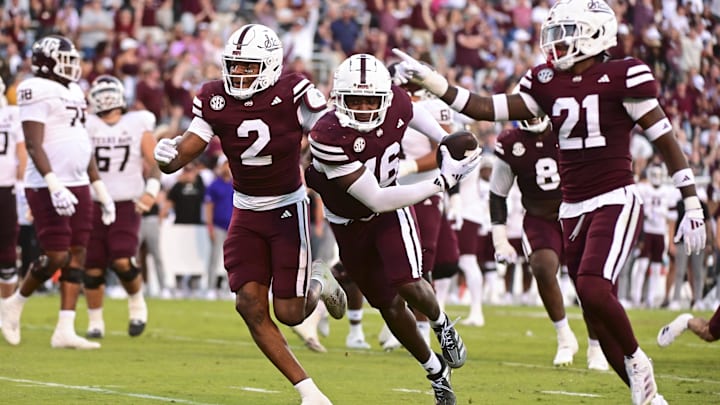 Oct 19, 2024; Starkville, Mississippi, USA; Mississippi State Bulldogs linebacker Zakari Tillman (16) reacts with teammates after an interception against the Texas A&M Aggies during the fourth quarter at Davis Wade Stadium at Scott Field. Mandatory Credit: Matt Bush-Imagn Images