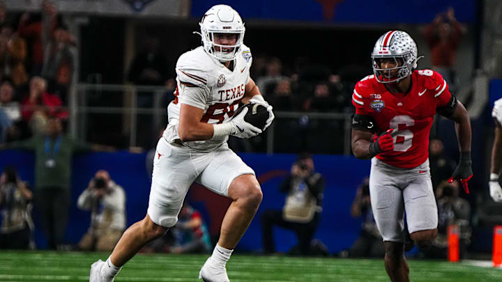 Texas Longhorns tight end Gunnar Helm (85) runs the ball during the College Football Playoff semifinal game against Ohio State in the Cotton Bowl at AT&T Stadium on Friday, Jan. 10, 2024 in Arlington, Texas.