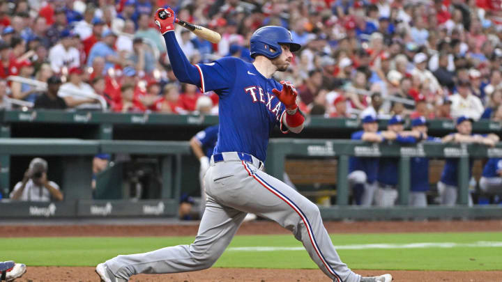 Jul 29, 2024; St. Louis, Missouri, USA; Texas Rangers catcher Jonah Heim (28) hits a one run single against the St. Louis Cardinals during the fourth inning at Busch Stadium. Mandatory Credit: Jeff Curry-USA TODAY Sports Jul 29, 2024; St. Louis, Missouri, USA; Texas Rangers catcher Jonah Heim (28) hits a one run single against the St. Louis Cardinals during the fourth inning at Busch Stadium. Mandatory Credit: Jeff Curry-USA TODAY Sports