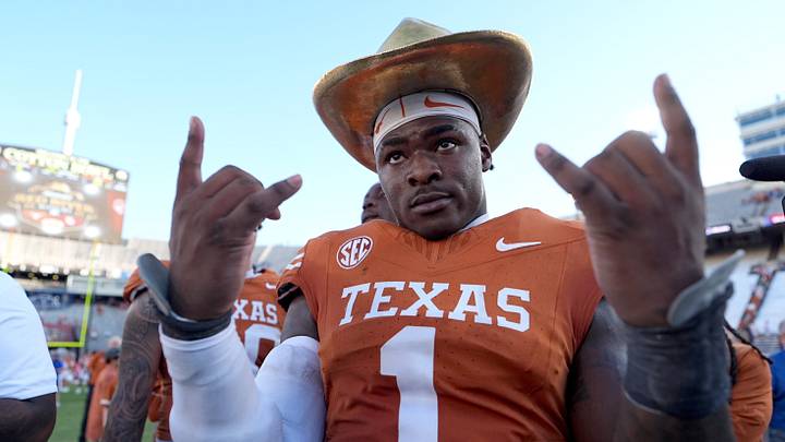 Texas Longhorns defensive end Colin Simmons (1) celebrates with the golden hat following the Red River Rivalry college football game. Texas Longhorns defensive end Colin Simmons (1) celebrates with the golden hat following the Red River Rivalry college football game.