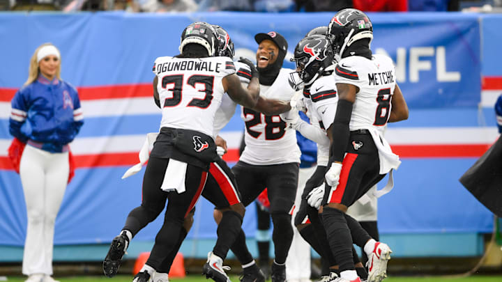 Jan 5, 2025; Nashville, Tennessee, USA; Houston Texans running back Joe Mixon (28) celebrates after running back Dameon Pierce (31) scored a touchdown against the Tennessee Titans during the first half at Nissan Stadium. Jan 5, 2025; Nashville, Tennessee, USA; Houston Texans running back Joe Mixon (28) celebrates after running back Dameon Pierce (31) scored a touchdown against the Tennessee Titans during the first half at Nissan Stadium.