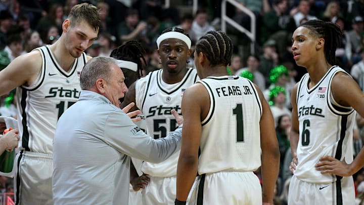 Feb 22, 2026; East Lansing, Michigan, USA;  Michigan State Spartans head coach Tom Izzo huddles with his players during the first half against the Ohio State Buckeyes at Jack Breslin Student Events Center. Mandatory Credit: Dale Young-Imagn Images