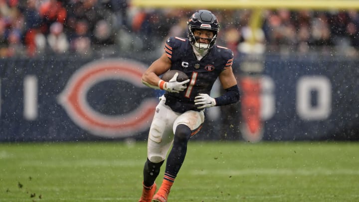 Dec 31, 2023; Chicago, Illinois, USA;  Chicago Bears quarterback Justin Fields (1) runs with the ball against the Atlanta Falcons at Soldier Field. Mandatory Credit: Jamie Sabau-USA TODAY Sports