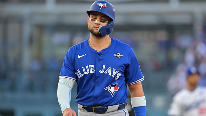Oct 27, 2025; Los Angeles, California, USA; Toronto Blue Jays second baseman Bo Bichette (11) reacts in the second inning against the Los Angeles Dodgers during game three of the 2025 MLB World Series at Dodger Stadium. 
