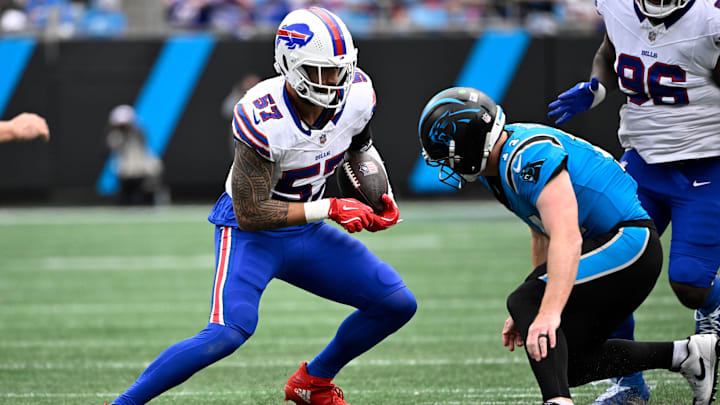 Oct 26, 2025; Charlotte, North Carolina, USA;  Buffalo Bills defensive end AJ Epenesa (57) returns an interception against Carolina Panthers quarterback Andy Dalton (14) in the second quarter at Bank of America Stadium.