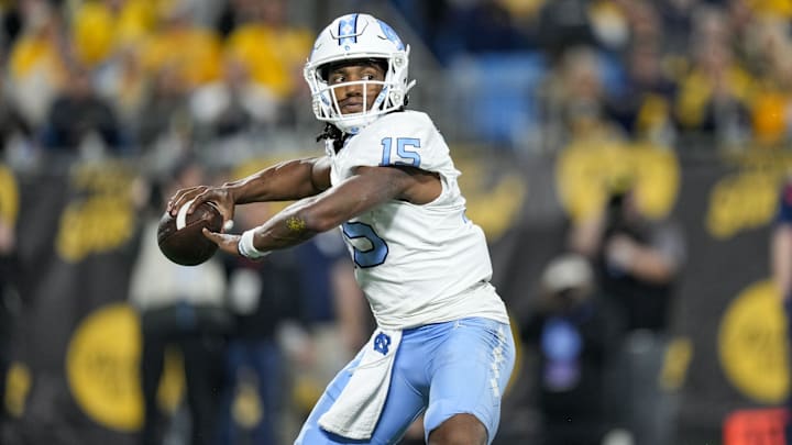 Dec 27, 2023; Charlotte, NC, USA; North Carolina Tar Heels quarterback Conner Harrell (15) throws the ball during the second half against the West Virginia Mountaineers at Bank of America Stadium. Mandatory Credit: Jim Dedmon-USA TODAY Sports
