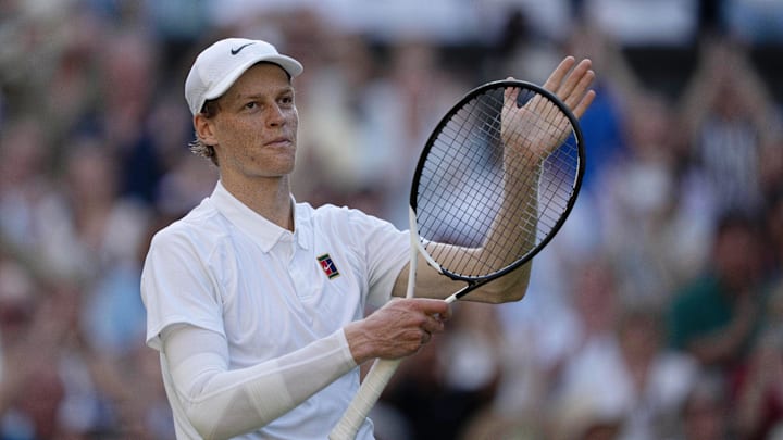 Jannik Sinner celebrates after winning his Wimbledon semifinal match against Novak Djokovic.