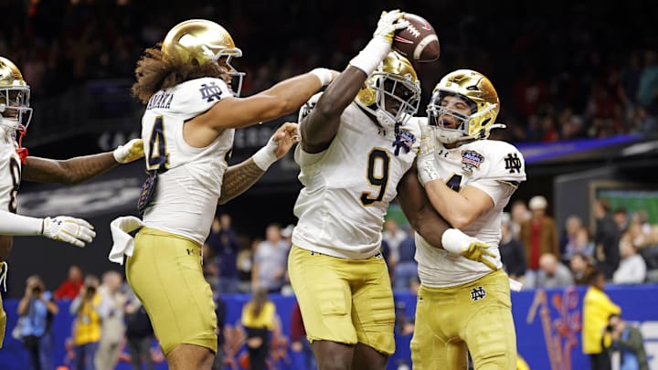 Jan 2, 2025; New Orleans, LA, USA; Notre Dame Fighting Irish defensive lineman Junior Tuihalamaka (44) reacts with Notre Dame Fighting Irish defensive lineman RJ Oben (9) after recovering a fumble during the second quarter after the game during the first half at Caesars Superdome. Mandatory Credit: Amber Searls-Imagn Images