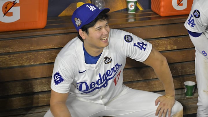 Oct 25, 2024; Los Angeles, California, USA; Los Angeles Dodgers designated hitter player Shohei Ohtani (17) celebrates in the dugout after defeating the Los Angeles Dodgers during game one of the 2024 MLB World Series at Dodger Stadium. Mandatory Credit:  Jayne Kamin-Oncea-Imagn Images
