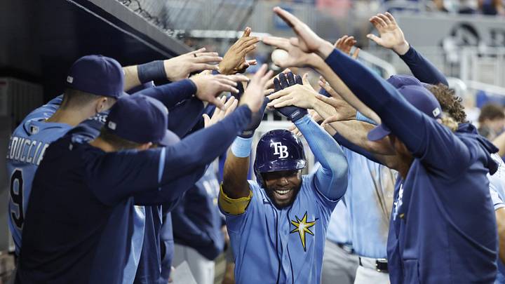 Jun 5, 2026; Miami, Florida, USA; Tampa Bay Rays center fielder Cedric Mullins (31) is greeted by teammates in the dugout following his solo home run against the Miami Marlins during the sixth inning at loanDepot Park. Jun 5, 2026; Miami, Florida, USA; Tampa Bay Rays center fielder Cedric Mullins (31) is greeted by teammates in the dugout following his solo home run against the Miami Marlins during the sixth inning at loanDepot Park.