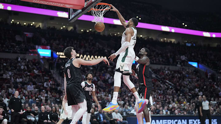 Jan 28, 2025; Portland, Oregon, USA; Milwaukee Bucks power forward Giannis Antetokounmpo (34) dunks the ball as Portland Trail Blazers small forward Deni Avdija (8), shooting guard Shaedon Sharpe (17), and center Deandre Ayton (2) look on during the second half at Moda Center. Mandatory Credit: Soobum Im-Imagn Images