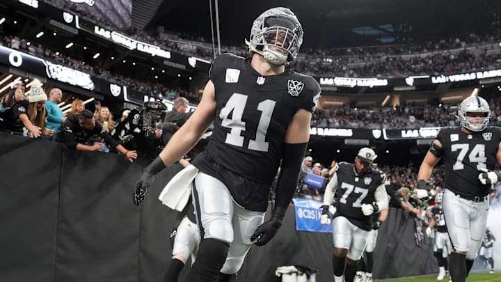 Las Vegas Raiders linebacker Robert Spillane enters the field before the game against the Jacksonville Jaguars at Allegiant Stadium.