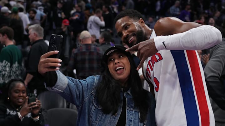 Dec 26, 2024; Sacramento, California, USA; Detroit Pistons guard Malik Beasley (5) takes a picture with a fan after the win against the Sacramento Kings at Golden 1 Center. Mandatory Credit: Kelley L Cox-Imagn Images Dec 26, 2024; Sacramento, California, USA; Detroit Pistons guard Malik Beasley (5) takes a picture with a fan after the win against the Sacramento Kings at Golden 1 Center. Mandatory Credit: Kelley L Cox-Imagn Images