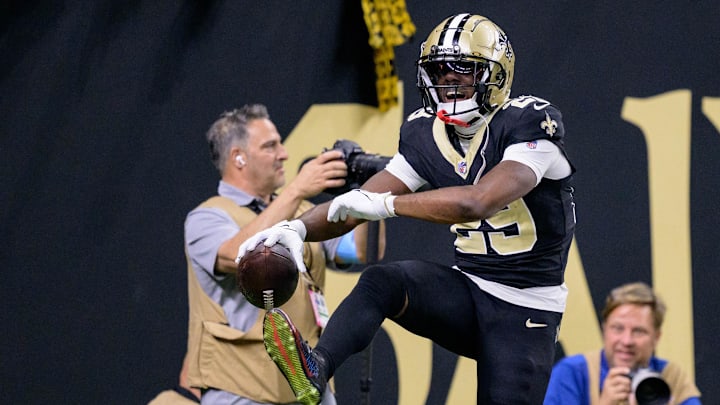Oct 13, 2024; New Orleans, Louisiana, USA; New Orleans Saints cornerback Paulson Adebo (29) celebrates an interception during the second quarter against the Tampa Bay Buccaneers at Caesars Superdome. Mandatory Credit: Matthew Hinton-Imagn Images