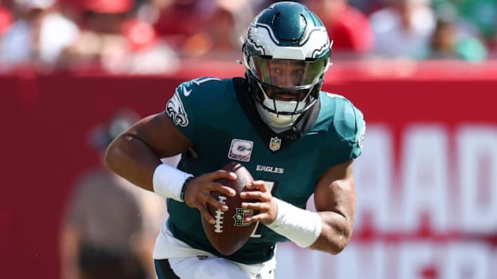 Sep 29, 2024; Tampa, Florida, USA; Philadelphia Eagles quarterback Jalen Hurts (1) runs with the ball against the Tampa Bay Buccaneers in the fourth quarter at Raymond James Stadium. Mandatory Credit: Nathan Ray Seebeck-Imagn Images
