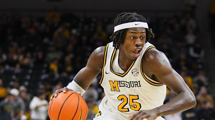Feb 12, 2025; Columbia, Missouri, USA; Missouri Tigers guard Mark Mitchell (25) dribbles the ball during the first half against the Oklahoma Sooners at Mizzou Arena. Mandatory Credit: Jay Biggerstaff-Imagn Images