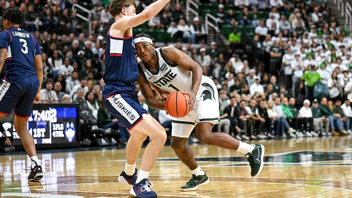 Michigan State’s Jeremy Fears Jr., right, is fouled by UConn’s Nik Khamenia during the first half on Tuesday, Oct. 20, 2026, at the Breslin Center in East Lansing. Michigan State’s Jeremy Fears Jr., right, is fouled by UConn’s Nik Khamenia during the first half on Tuesday, Oct. 20, 2026, at the Breslin Center in East Lansing.