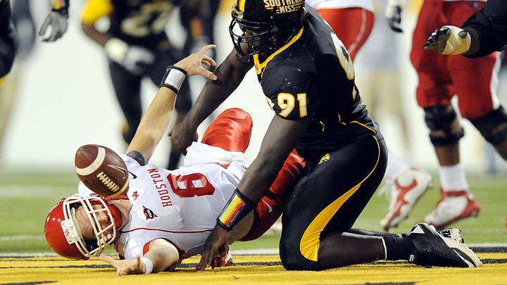 November 20, 2010; Hattiersburg, MS, USA; University of Houston Cougars quarterback David Piland loses the football as he is sacked by Southern Miss Golden Eagles defensive end Cordaro Law during the first half at M.M. Roberts Stadium. Houston recovered the fumble. Mandatory Credit: Chuck Cook-Imagn Images November 20, 2010; Hattiersburg, MS, USA; University of Houston Cougars quarterback David Piland loses the football as he is sacked by Southern Miss Golden Eagles defensive end Cordaro Law during the first half at M.M. Roberts Stadium. Houston recovered the fumble. Mandatory Credit: Chuck Cook-Imagn Images