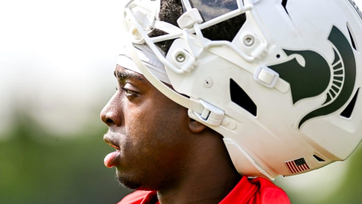 Michigan State quarterback Aidan Chiles looks on Aidan during the first day of football camp on Tuesday, July 30, 2024, in East Lansing. Michigan State quarterback Aidan Chiles looks on Aidan during the first day of football camp on Tuesday, July 30, 2024, in East Lansing.