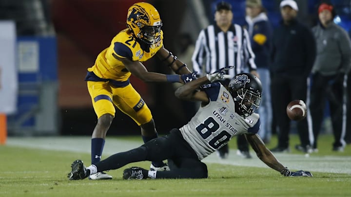 Dec 20, 2019; Frisco, TX, USA; Utah State Aggies wide receiver Siaosi Mariner (80) attempts to catch a pass as Kent State Golden Flashes cornerback Montre Miller (21) defends in the second quarter during the Frisco Bowl at Toyota Stadium. Mandatory Credit: Tim Heitman-USA TODAY Sports